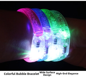 Detail of colorful LED bubble bracelets in pink, blue, and green with a wide surface design