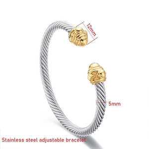 Detail showing 5mm stainless steel twisted cable texture and 12mm golden carved end cap