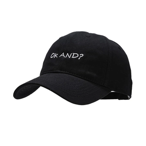 Classic black cotton baseball cap with white OK AND embroidered text in a minimalist style