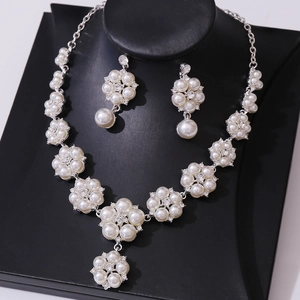Elegant gold-tone pearl necklace and earring set with flower-shaped rhinestones