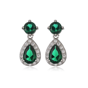 Luxury green teardrop zircon earrings with silver setting in professional studio shot