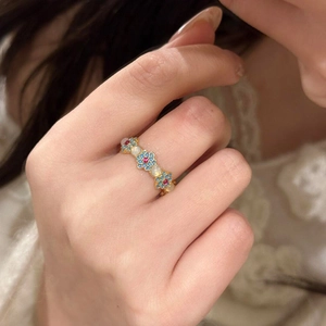 18k gold plated open ring with blue flowers and white zircons on model finger