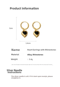 Detailed view of heart-shaped gold-plated hoop earrings with black rhinestones and dimensions