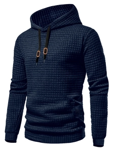 Detail shot of navy blue men's hoodie featuring waffle knit texture and black drawstrings