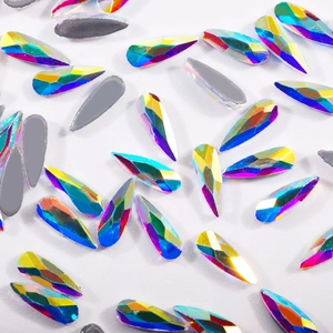 Macro shot of AB iridescent teardrop flatback crystals for DIY nail art and decoration