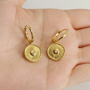 18K gold plated titanium steel hoop earrings with crystal compass pendant on hand