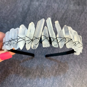 Detailed view of handmade white crystal tiara with wire-wrapped natural quartz stones