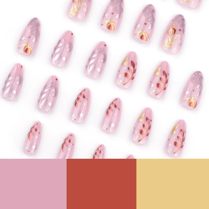 Almond press-on nails with autumn pumpkin and leaf patterns on a pink base