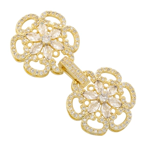 Macro detail of gold flower clasp connector with cubic zirconia for multi-strand necklaces