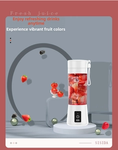 Portable white electric juicer blender showing fresh strawberries and ice cubes inside