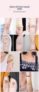 Detail view of 30 colorful temporary tattoo designs with artistic hand-painted crayon patterns