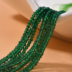 Macro shot of 2mm faceted dark green crystal beads for DIY jewelry making accessories