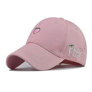 Close-up of pink cotton baseball cap with peach embroidery and Fresh Fruit side text