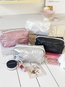Bow embossed cloud makeup bag with pearl pendant in four metallic colors