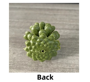 Macro detail of the back view of a dark green plastic pine cone for Christmas decor