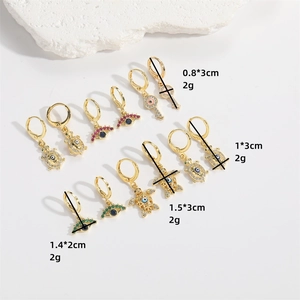 Golden turtle and evil eye drop earring set with multicolor zircons on white stone base