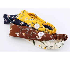 Detail of four floral headbands with side buttons for mask pressure relief