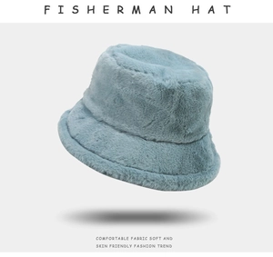 Detail of soft light grey blue plush texture on a stylish faux fur fisherman hat