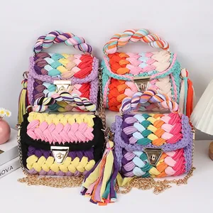 Handmade crochet crossbody bags with colorful weave patterns and tassel charms