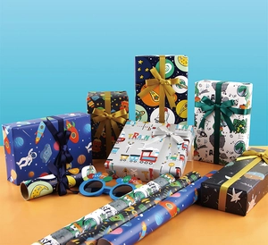 Various cute cartoon gift wrapping paper rolls featuring space and dinosaur theme designs