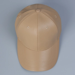 Top view detail of a khaki PU leather baseball cap showing stitching on the brim