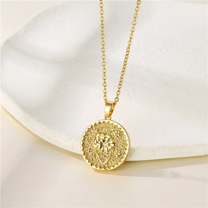 Gold stainless steel birth flower coin necklace with zircon stone on white plate