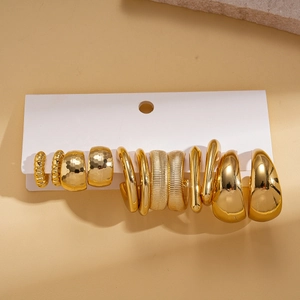 12-piece set of gold geometric hoop earrings including hammered and textured C-shaped designs