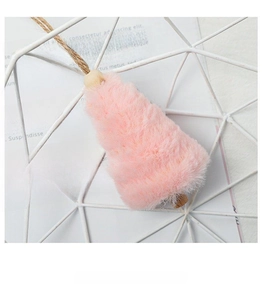 Detail of pink plush Christmas tree ornament with wooden base and hanging rope
