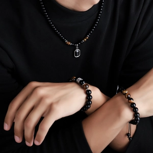 Men's tiger eye and black bead jewelry set with pendant necklace and woven bracelets