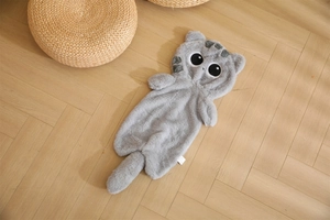 Detailed view of grey plush cat pillow shell with embroidery and soft fur texture