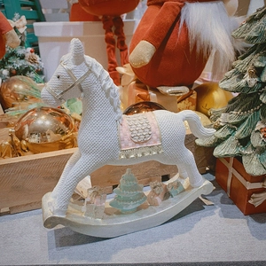 Elegant white resin rocking horse ornament with pink and gold festive Christmas decorations