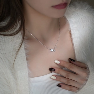 Elegant S999 sterling silver necklace with cloud pendant and white shell on model