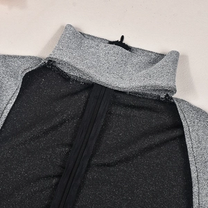 Detail of high neck design with invisible zipper on metallic silver stretch bodysuit