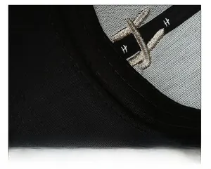 Close-up of black baseball cap interior showing reinforced sweatband and fine stitching