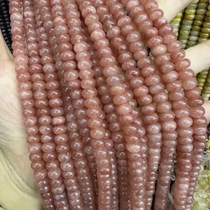 Close-up of semi-transparent strawberry quartz abacus beads for DIY jewelry making
