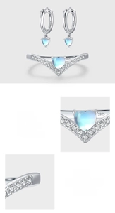 Detailed view of S925 sterling silver heart moonstone earrings and pavé V-ring set