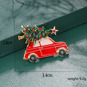 Detail view of a vintage red car Christmas brooch with tree, size 3.4cm x 2.6cm
