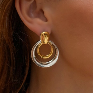 Minimalist double layer hollow round earrings in gold and silver finish on model