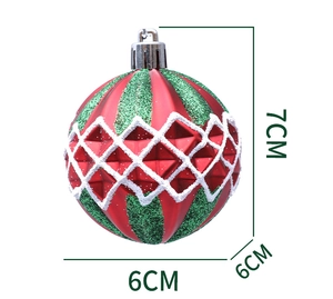 Detail of red and green striped Christmas ball with glitter grid pattern and 7cm size tag