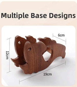 Detailed view of fish-shaped wooden trivet showing natural grain and dimensions