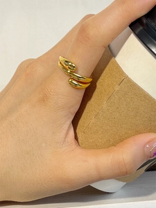 Minimalist S925 sterling silver water drop wrap ring in gold finish on female hand
