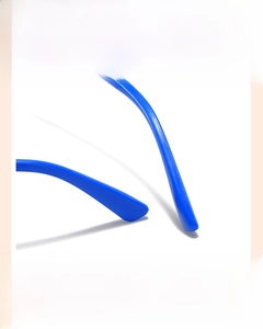 Macro detail of ergonomic blue non-slip curved temple tips on kids sunglasses