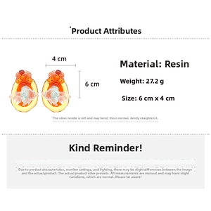 Macro detail of resin goldfish and flower earrings with 6cm size and weight specs