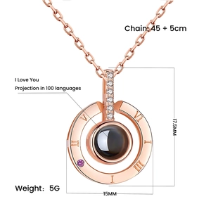 Rose gold projection necklace with Roman numerals and purple stone in 100 languages