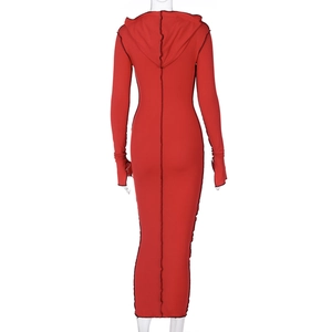 Detail view of the back of a red hooded long sleeve dress with black contrast stitching