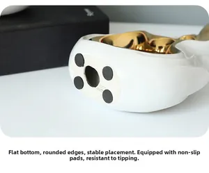 Close-up of ceramic ornament base featuring four black non-slip pads and flat bottom surface