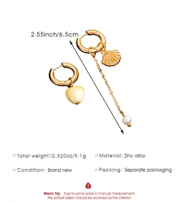 Asymmetrical gold earrings with heart pendant, shell detail, and pearl chain measurement