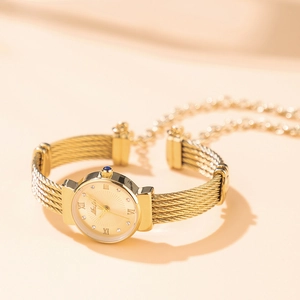 Elegant gold bracelet watch for women with Roman numerals and diamond accents