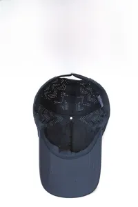 Detail view of breathable navy mesh fabric and moisture-wicking sweatband inside the cap