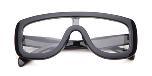 Detail of oversized black pilot glasses with polished frames and clear lenses